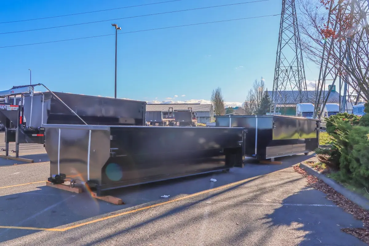 Roll-off dumpster ready for waste disposal at job site for 15 Yard Dumpster Rental in Peters